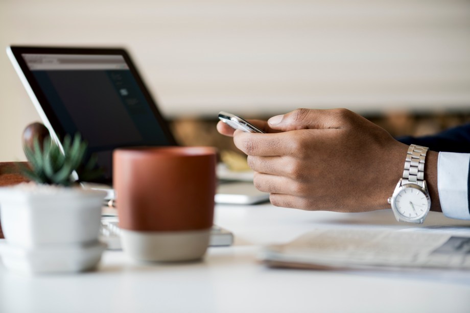 Businessman using mobile phone at work